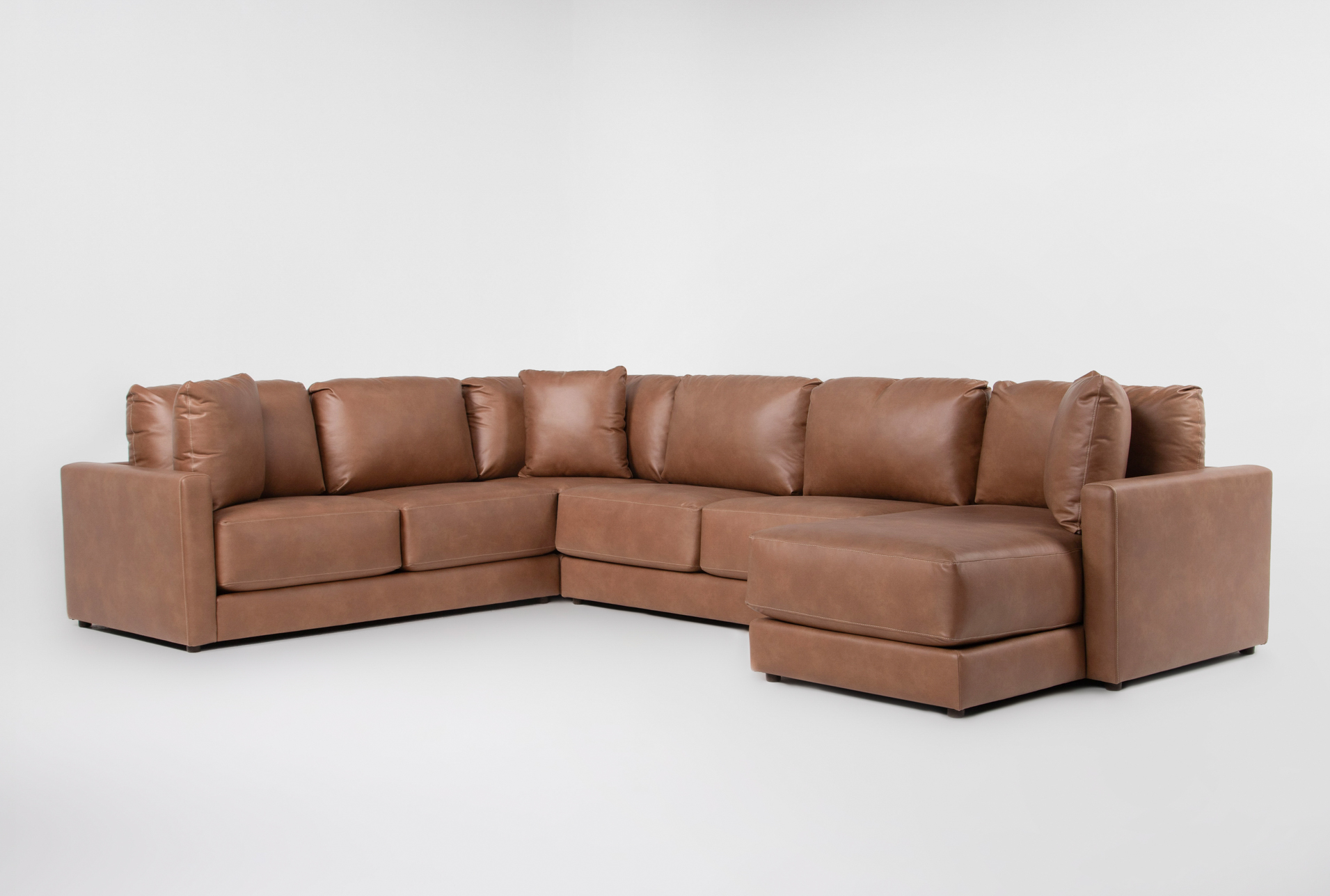 alicia saddle brown vegan faux leather 140" 4 piece sectional with right arm facing chaise | fabric | loose reversible back 1 alicia saddle brown vegan faux leather 140" 4 piece sectional with right arm facing chaise | fabric | loose reversible back